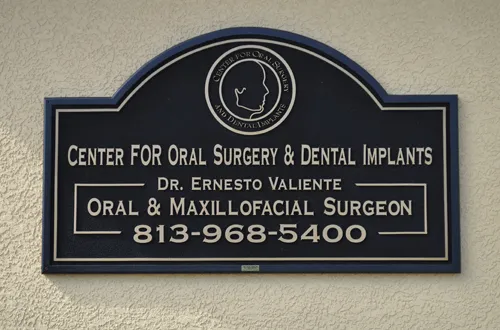 Center for Oral Surgery & Dental Implants sign with Dr. Ernesto Valiente, phone 813-968-5400