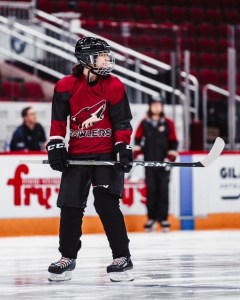 woman playing hockey